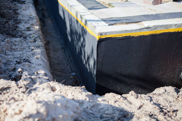 Professional Basement Waterproofing technician working in Dora, AL